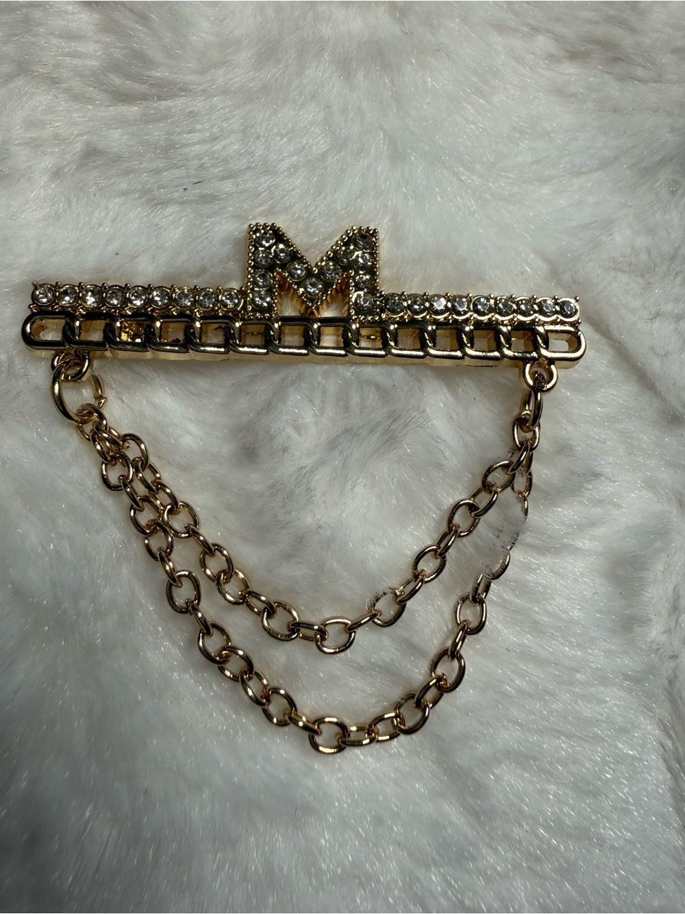 Gold Tone Charm With Rhinestones and Chain Detail